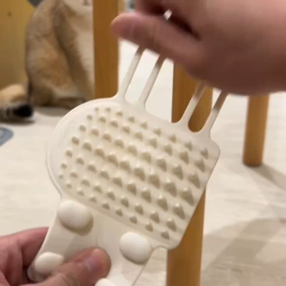 Close-up of the silicone bristles on the cat self-groomer