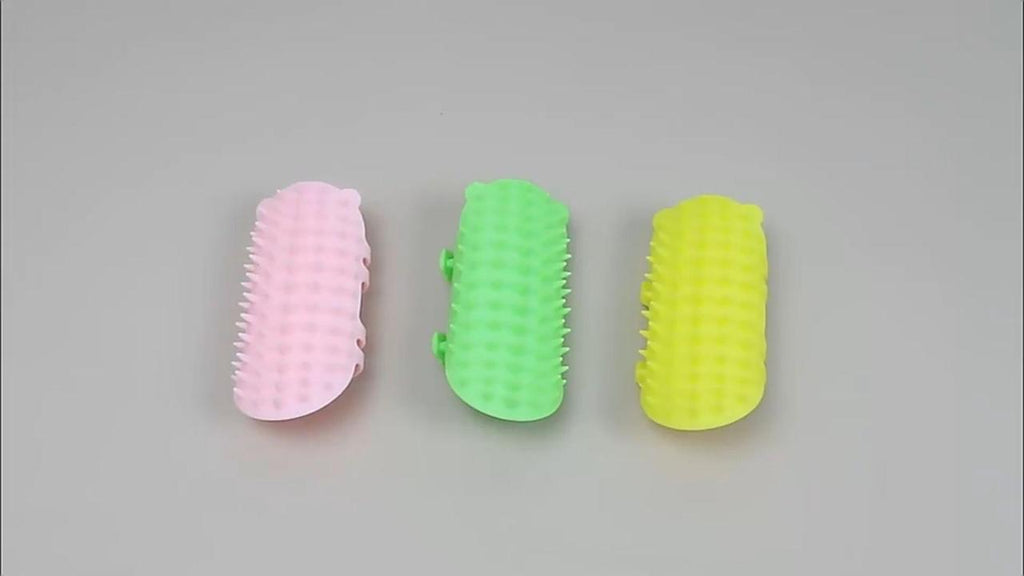 Cat self-groomers in pink, green and yellow