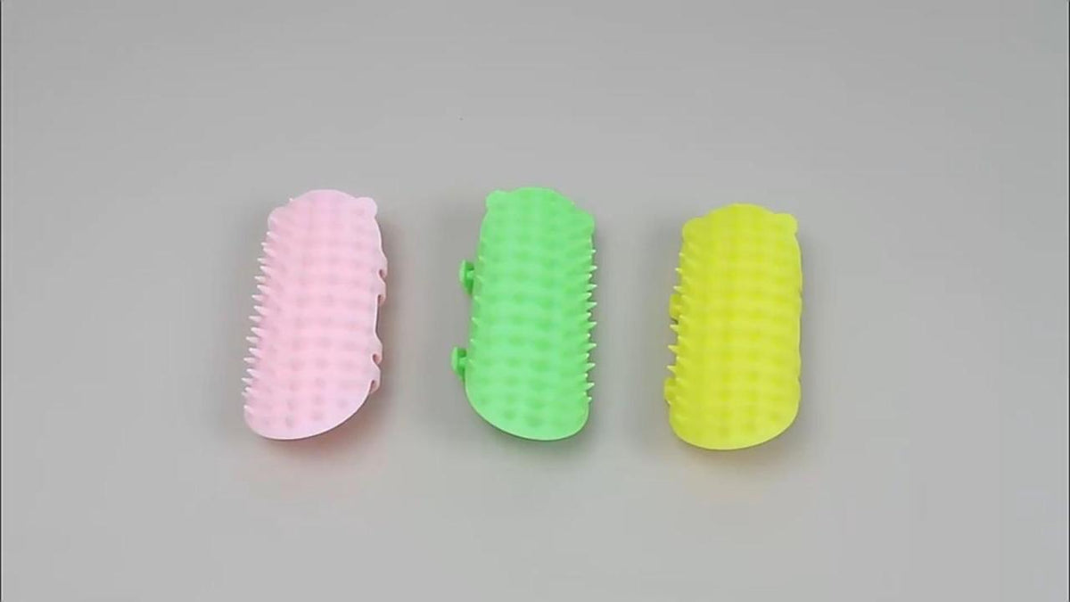 Cat self-groomers in pink, green and yellow